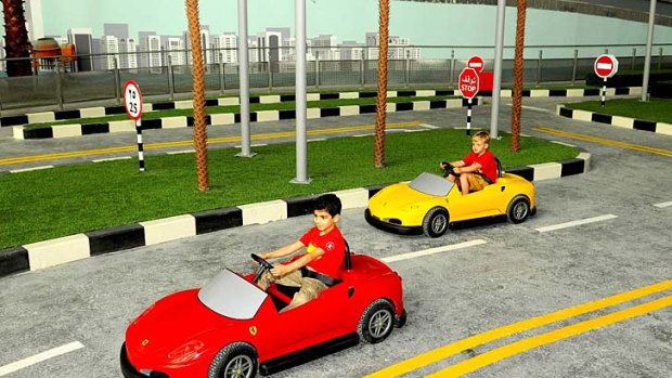 Children manoeuvre rides at Ferrari World Abu Dhabi.