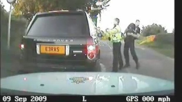 Police officers attack the car of a pensioner after he failed to stop.