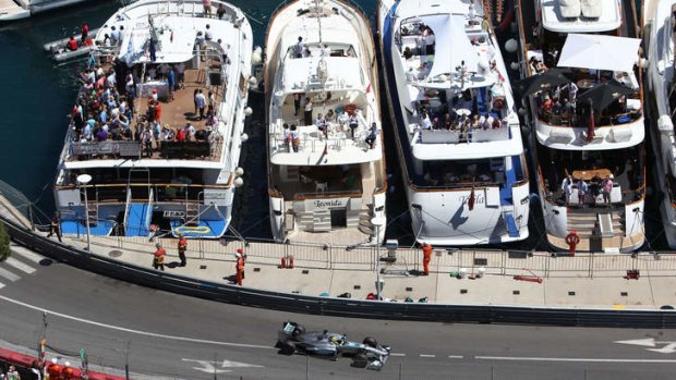 Shining silver: Germany's Nico Rosberg led a 'modestly paced parade' through the streets of Monte Carlo last Sunday.