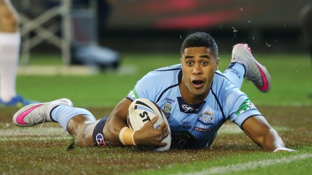 Best on ground: Michael Jennings celebrates the opening try for NSW on Wednesday.