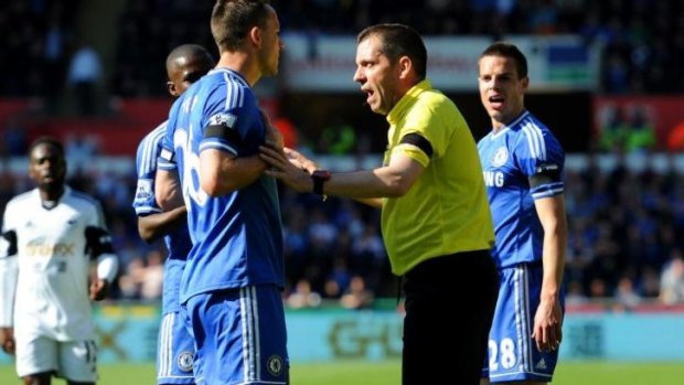 John Terry of Swansea remonstrates with referee Phil Dowd after teammate Andre Schurrle was fouled by Chico Flores.