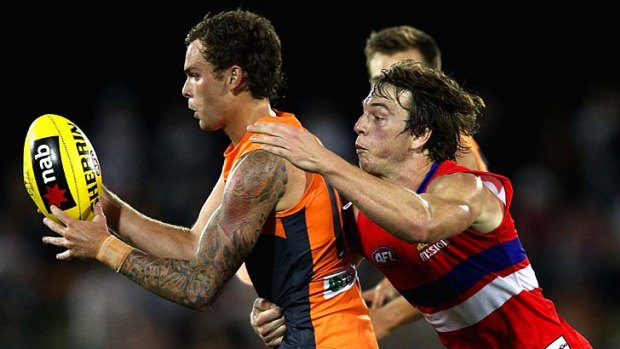 Liam Picken, seen tackling Nathan Wilson of the Giants, is another of the top taggers.