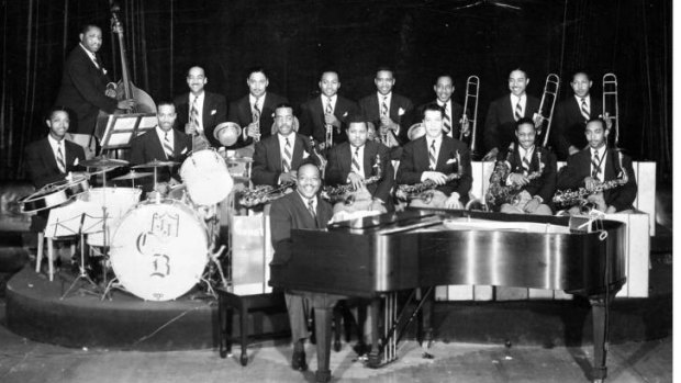 Songs swung blue ... Count Basie with his band.