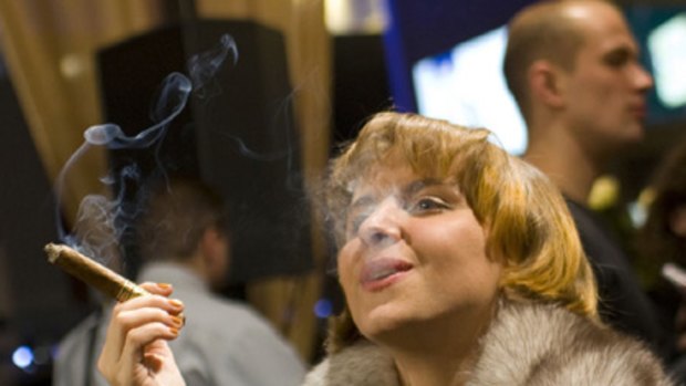 Havana social club ... exclusive cigar bars evade smoking bans.