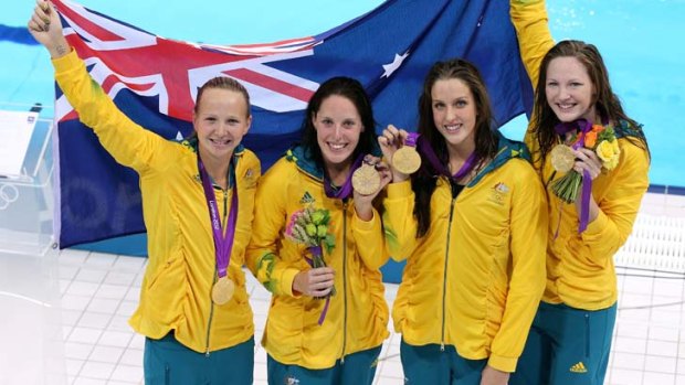 Cate Campbell (far right) celebrates her women's 4x100m freestyle relay gold medal with teammates (from left) Melanie Schlanger, Alicia Coutts and Brittany Elmslie.