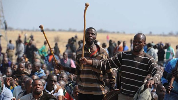Roused ... striking miners react to Julius Malema's speech.