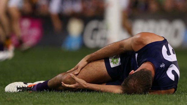 Fremantle's Kepler Bradley grabs his right knee during the round five match against Richmond at Patersons Stadium.