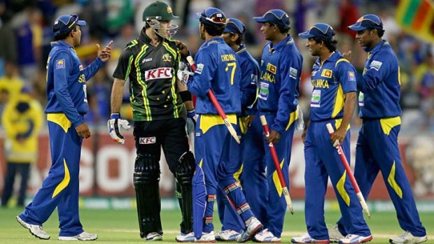 Tense finish ... Glenn Maxwell remonstrates with the Sri Lankan team after the final ball of Australia's tense loss.