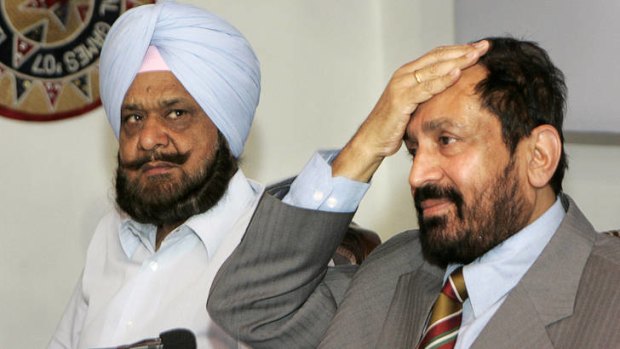 Blame ... former Indian Olympic Association officials Suresh Kalmadi, right, and  Randhir Singh in a 2008 file photo.