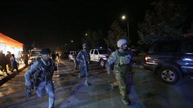 Security forces rush to respond to a Taliban attack on the campus of the American University in the Afghan capital Kabul on August 24 nearly three weeks after Timothy Weeks was kidnapped.