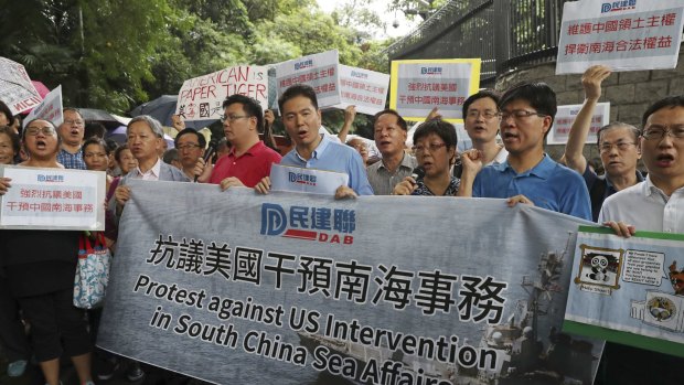 Pro-Beijing protesters outside the US consulate in Hong Kong protest against the US supporting the court ruling.