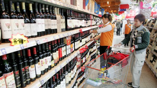 A woman browses Chinese wines in a store in Beijing, China.