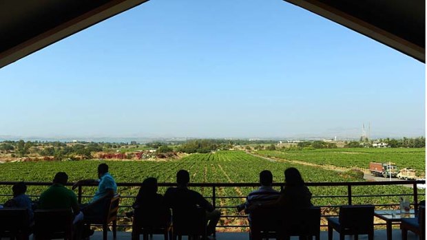 Visitors enjoy wine at the lounge bar at the Sula Vineyard, India's first vineyard resort, in Nashik.