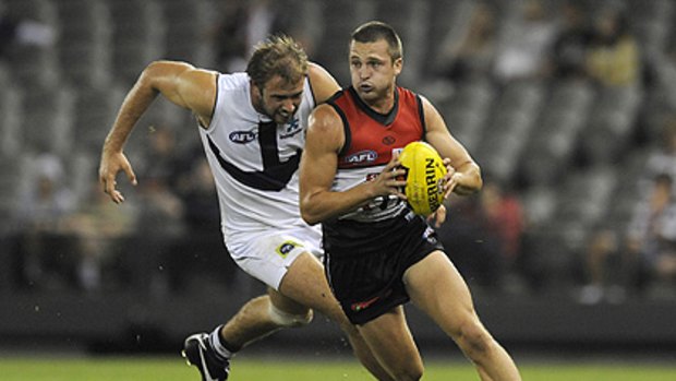 St.Kilda's Jarryn Geary is chased by Fremantle's Kepler Bradley during the Saints' thrashing of the Dockers at Etihad Stadium.