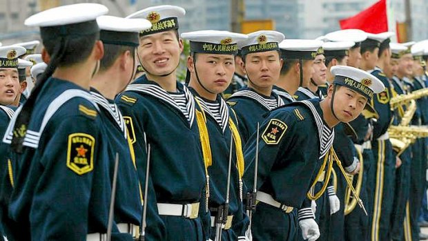 Chinese naval soldiers wait in line.