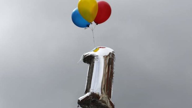 A balloon marking the first anniversary of WikiLeaks founder Julian Assange's entry to Ecuador's embassy is tethered above the building in central London June 16, 2013. Assange sought asylum in the embassy on June 19, 2012, in an attempt to avoid extradition to Sweden.