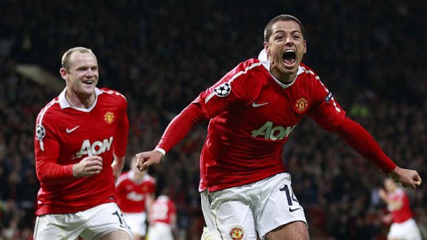 First blood ... Manchester United's Javier Hernandez, right, and Wayne Rooney celebrate the Mexican's goal against Chelsea in the Champions League quarter-final at Old Trafford.
