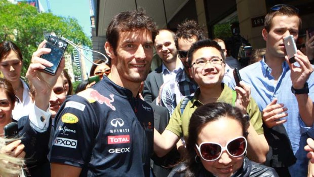 Racing ahead ...  Formula One’s Mark Webber was almost as quick with a camera as he is on track when he met fans in Sydney yesterday. Webber expressed sadness over the death of Dan Wheldon.