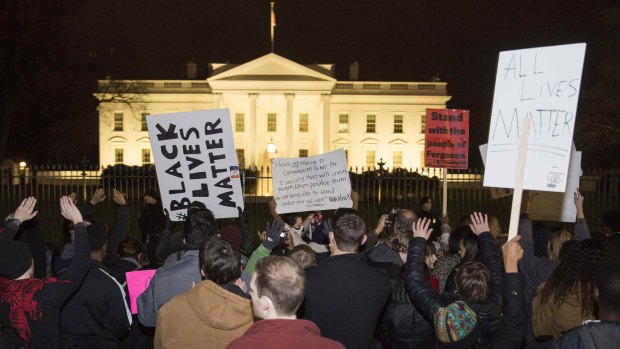 Demonstrators hold a 'Justice for Mike Brown' march and rally after a grand jury failed to indict a white police officer in the shooting death of African-American teenager Michael Brown, in front of the White House.