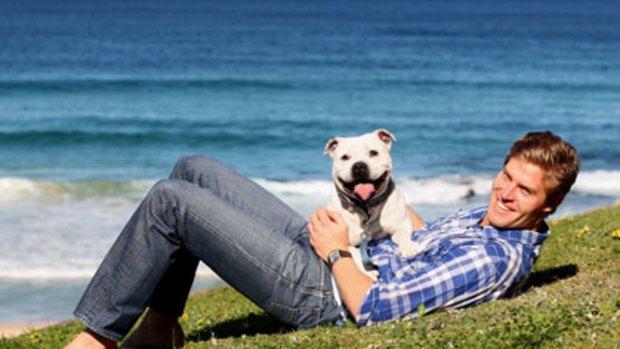 Pet pals ... Dr Chris Brown with one of his canine patients, Floyd, a three-year-old Staffordshire bull terrier.