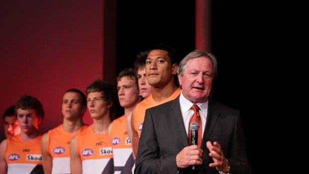 Giants of men . . . Israel Folau and his GWS teammates look on  as coach Kevin Sheedy addresses the audience at last night's launch.
