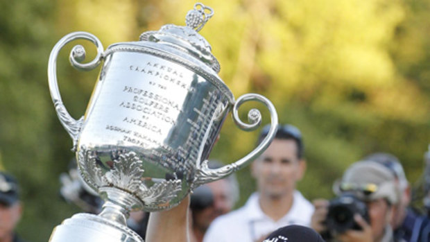 Germany's Martin Kaymer hoists the Wanamaker Trophy aloft.