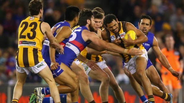 Cyril Rioli comes up against Footscray defenders during the VFL grand final on Sunday.