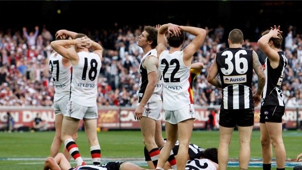 Empty feeling: Collingwood and St Kilda players after the drawn grand final in 2010.