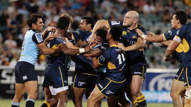 Handbags: Waratahs and Brumbies players get testy with each other in Canberra.