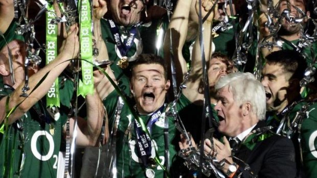 In the thick of it: Brian O'Driscoll celebrates winning the Six Nations crown with his Irish teammates.