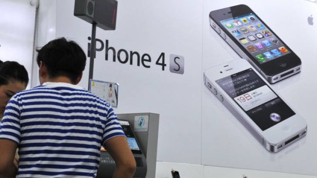 The Apple iPhone 4S on display in Tokyo. Apple is expected to launch its new iPhone model in September.