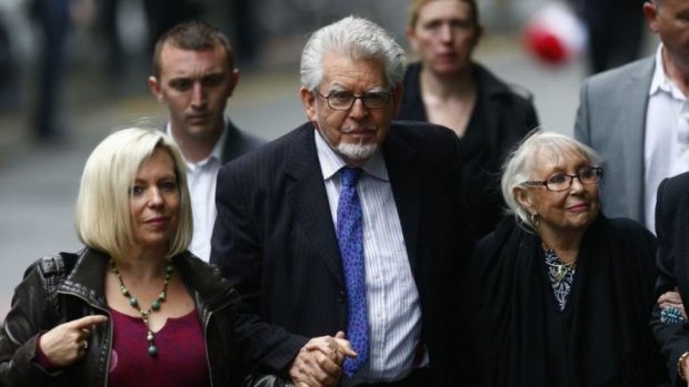 Supporters: Rolf Harris arrives with his daughter Bindi, left, and wife Alwen Hughes, right, at court in London.