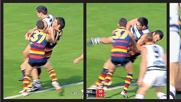 Ian Callinan and Taylor Walker stop Harry Taylor, who is lifted and taken to ground by Walker.