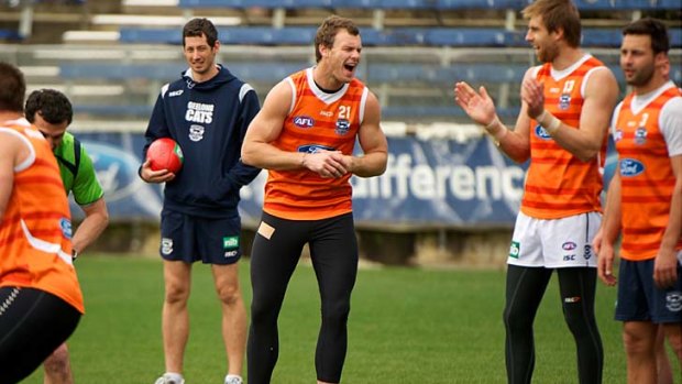 Laughs: Cameron Mooney shares a joke with Tom Lonergan and Jimmy Bartel at training as he prepares for his long-awaited return to senior football.