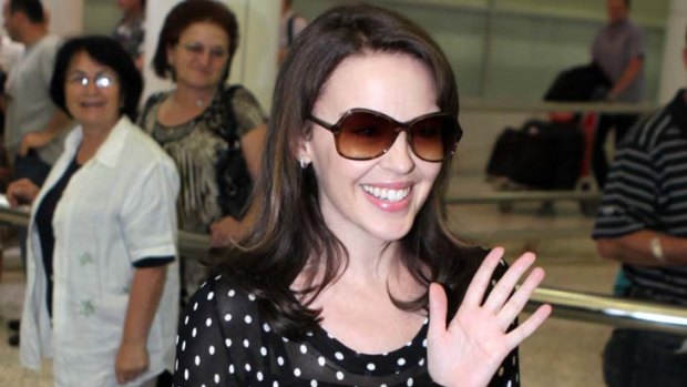7.30am &#8230; pop princess Kylie Minogue lands in Sydney yesterday.
