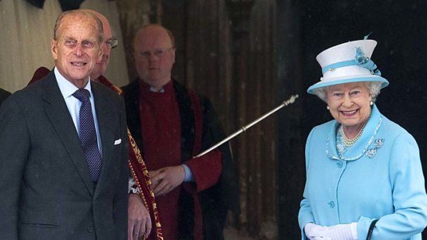 Happy birthday ... Prince Philip and the Queen arrive for the church service.