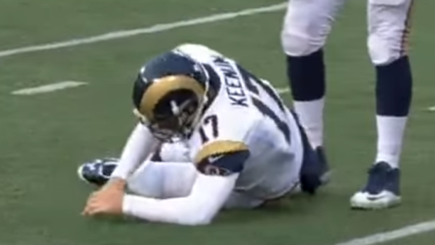 Down and out: Case Keenum suffers a head knock but plays on for the Rams.