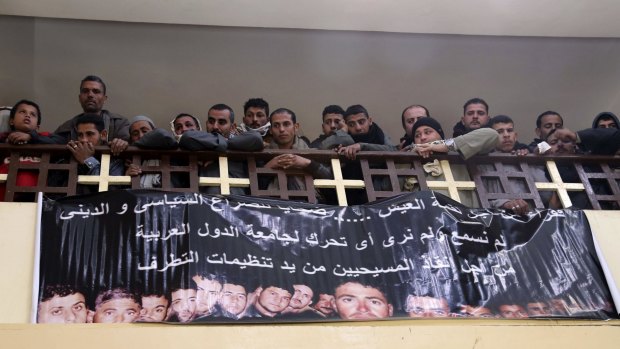 Friends and family of Egyptian Coptic Christian men killed by Islamic State in Libya attend a church service.