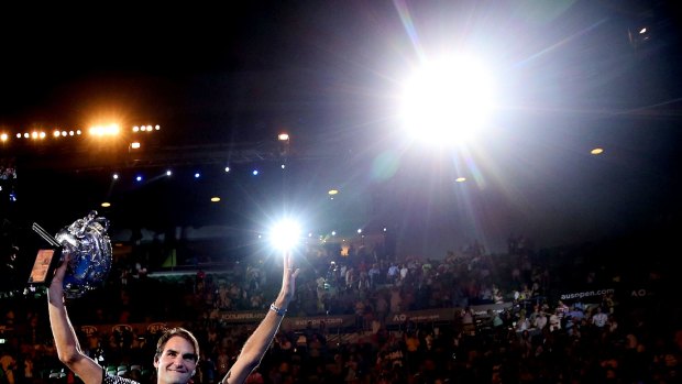 Roger Federer with the Norman Brookes Challenge Cup in his hands again.