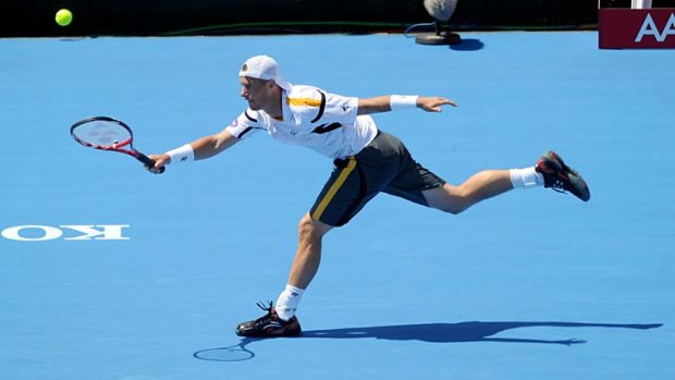 Reaching out: Lleyton Hewitt stretches for a shot at Kooyong on Wednesday.