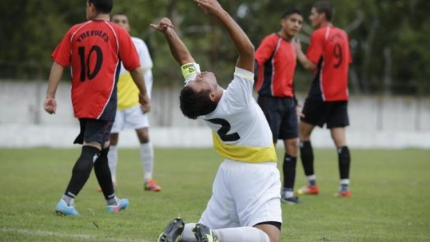 Ernesto Ortiz of Papa Francisco reacts after missing a chance to score against Trefules