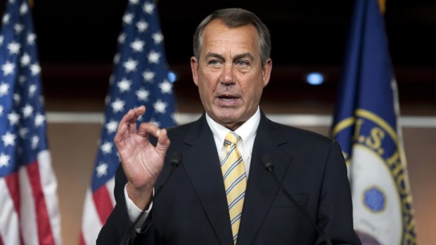 US House Speaker John Boehner ... makes a "zero" gesture as he speaks with reporters about the federal budget.