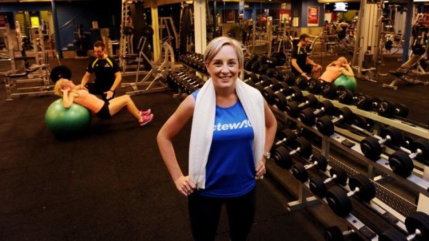 ActewAGL workers Jess Brown (right) Tracey McRoberts (background, on ball) have the use of the Fitness First gym in the Canberra Centre as an employment perk.