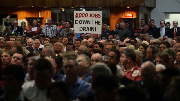 Demanding answers ... worried residents and farmers from the Griffith area at the meeting yesterday.