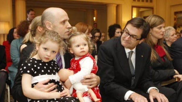 New kids on the block... Mark Arbib,  with daughters Alexandra, 3, and Charlotte, 1,  and Greg Combet wait to be sworn in.