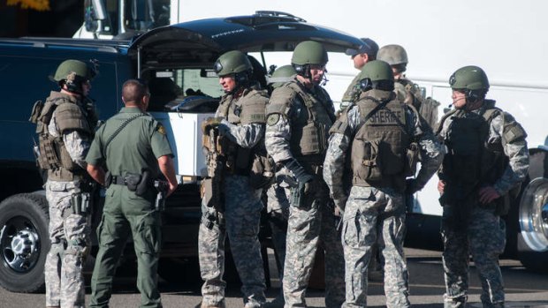 Swat team members secure the scene near Sparks Middle School in Sparks, Nevada, after a shooting there on Monday that left two dead and two seriously injured.