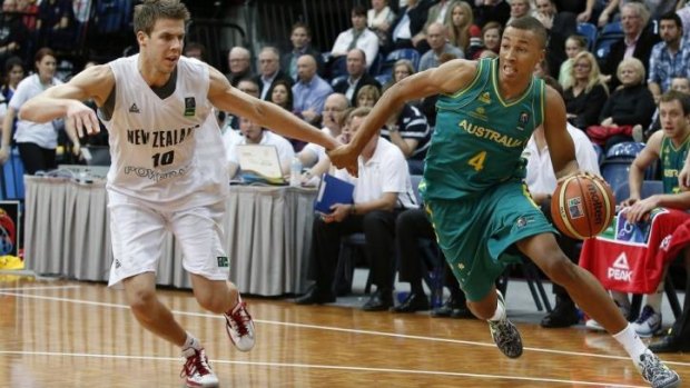 Dante Exum (right) in action for the Boomers against New Zealand last year.