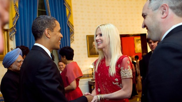 This White House photo shows uninvited couple Michaele and Tareq Salahi meeting President Obama at a state dinner for Indian Prime Minister Manmohan Singh.