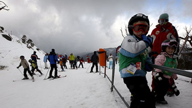 Kids play ... plenty of snow at Thredbo and other Snowy Mountain resorts kept the skiers happy at the weekend.