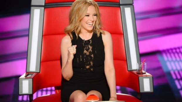 Playful: Kylie Minogue in the judge's chair on <i>The Voice</i>.